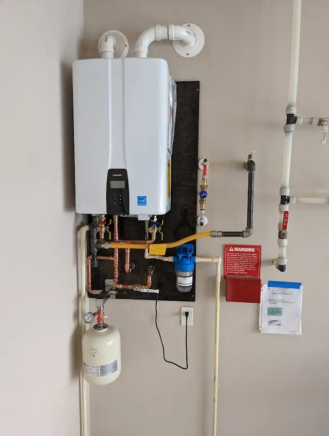 Professional plumber installing copper piping in a Hardeeville home